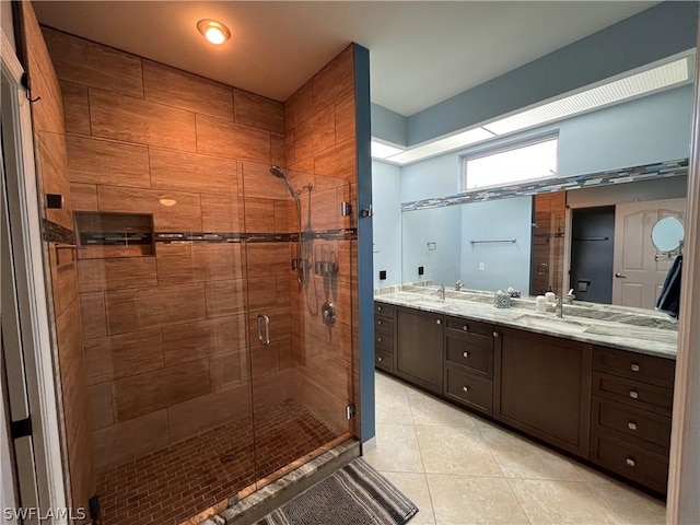 bathroom with tile patterned flooring, vanity, and an enclosed shower