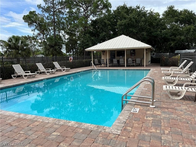 view of pool featuring a patio