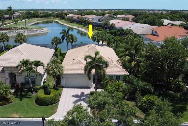 birds eye view of property with a water view