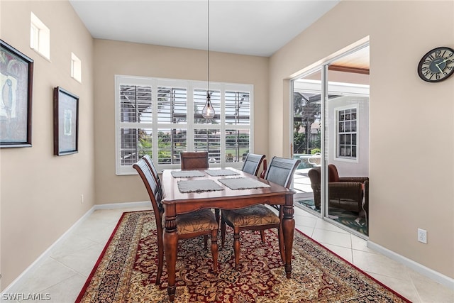 dining area featuring light tile patterned floors