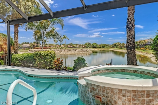 view of swimming pool featuring glass enclosure, an in ground hot tub, and a water view