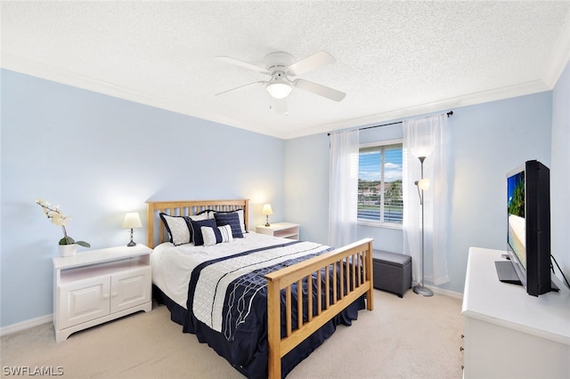 bedroom featuring a textured ceiling, light colored carpet, ceiling fan, and crown molding