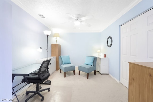 home office with ceiling fan, light colored carpet, a textured ceiling, and ornamental molding