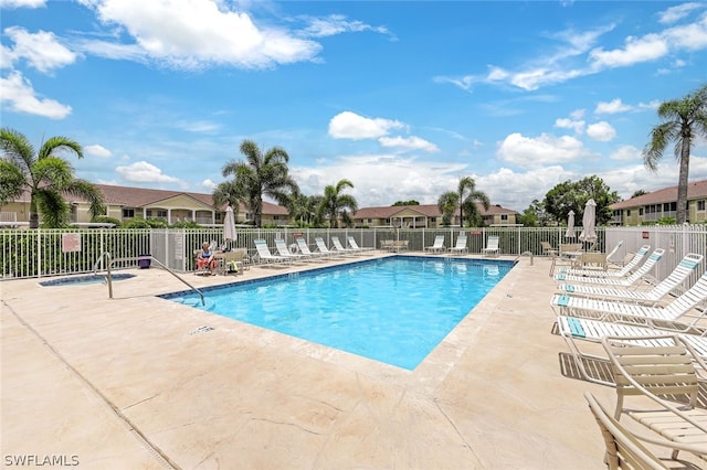 view of swimming pool featuring a patio area