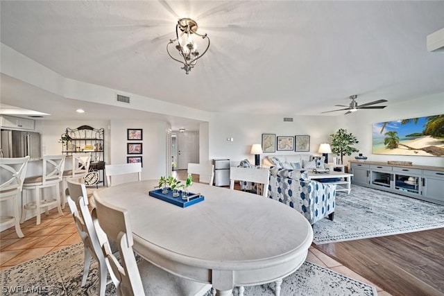 tiled dining room with ceiling fan