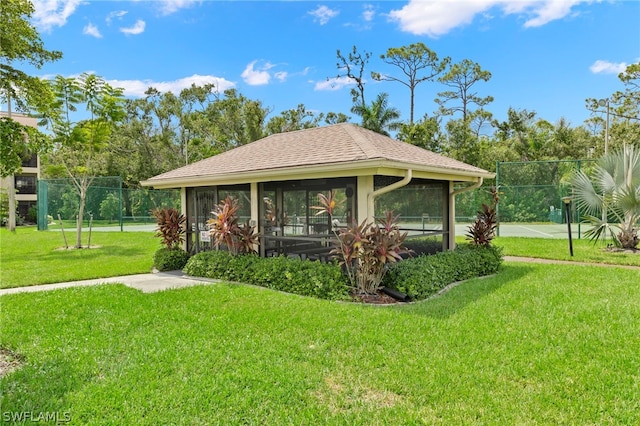 exterior space featuring a yard and fence