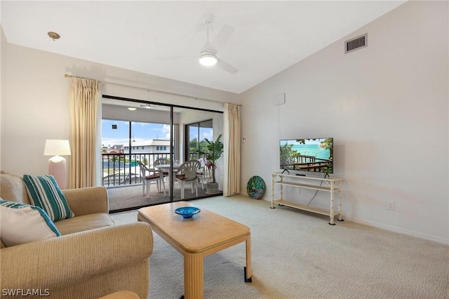 living room featuring carpet floors, vaulted ceiling, and ceiling fan