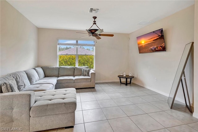 living room featuring light tile patterned floors and ceiling fan