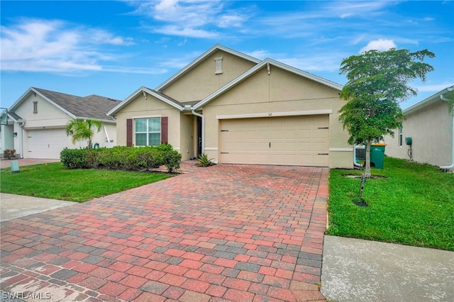 single story home with a garage and a front lawn