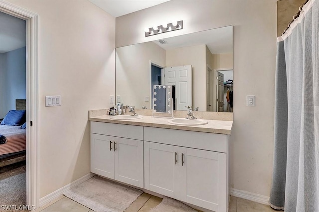 bathroom featuring vanity and tile patterned flooring