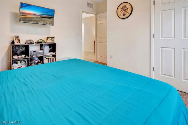 bedroom featuring tile floors