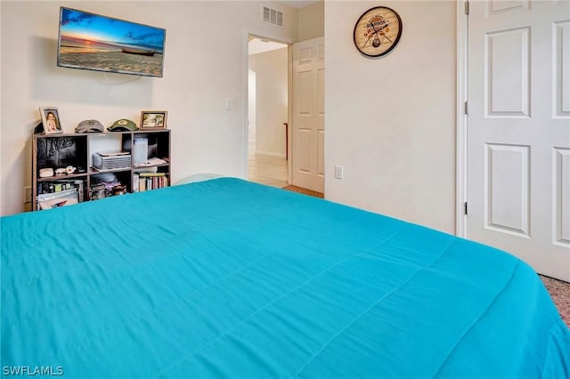 bedroom featuring tile patterned flooring