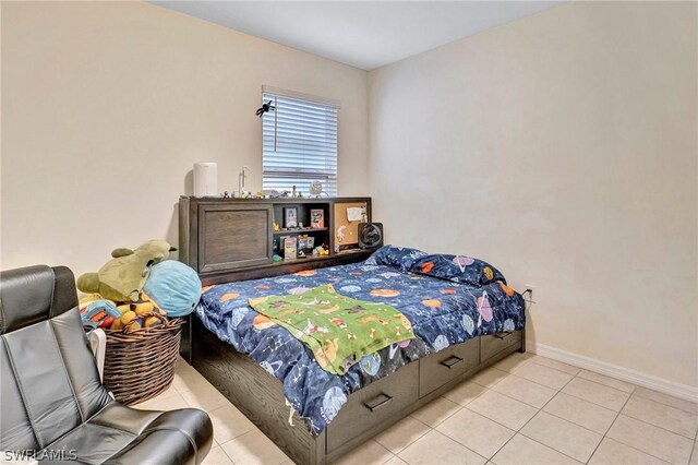 bedroom featuring light tile floors