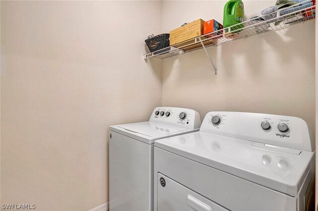 laundry area with washing machine and dryer