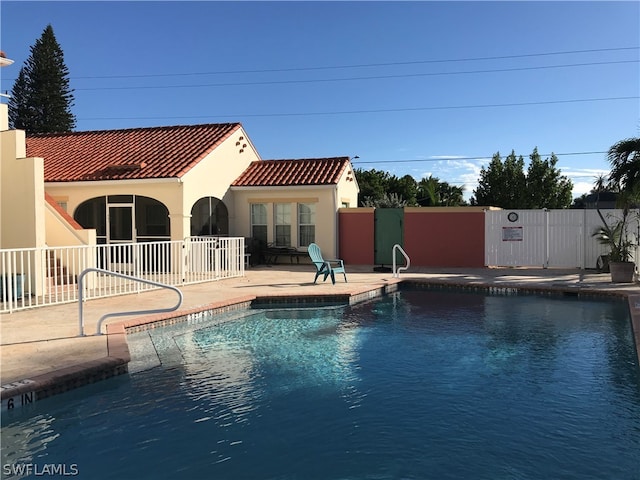 view of swimming pool with a patio area