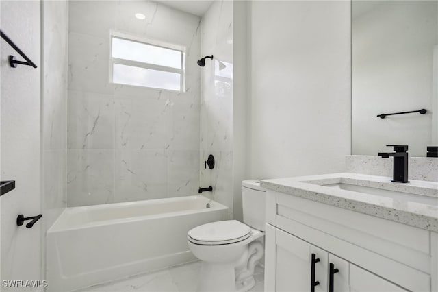 full bathroom with vanity, toilet, and tiled shower / bath combo