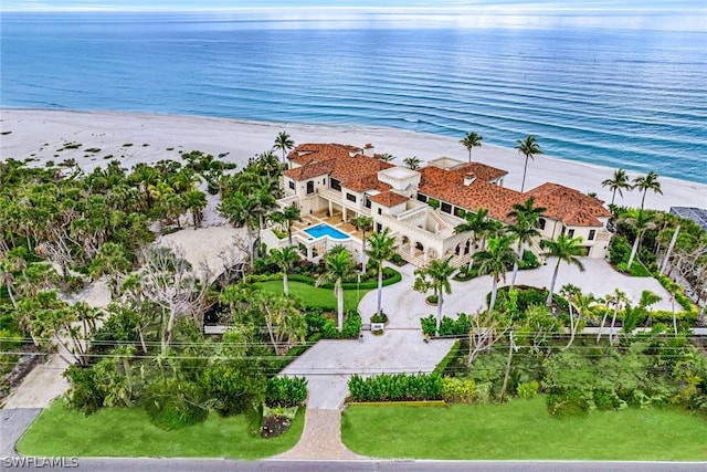 drone / aerial view with a water view and a view of the beach