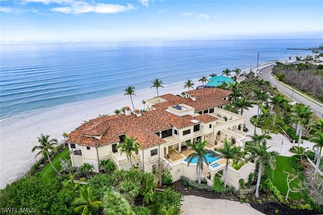 bird's eye view with a water view and a view of the beach