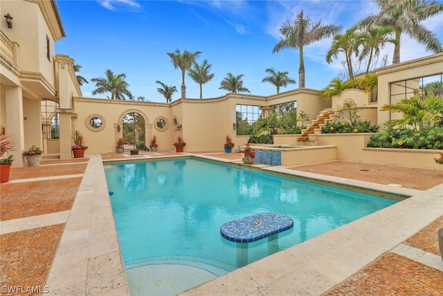 view of swimming pool with a patio area