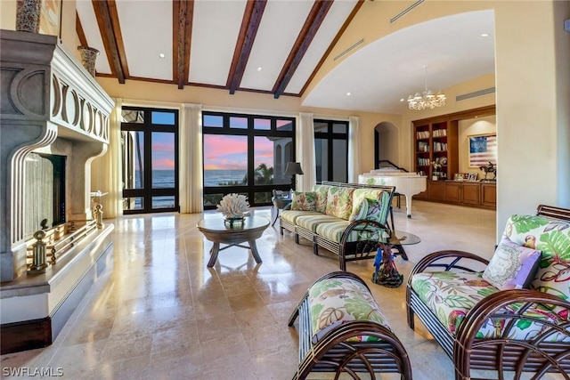 living room with lofted ceiling with beams and a notable chandelier