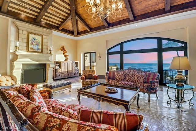 living room featuring hardwood / wood-style floors, beam ceiling, wooden ceiling, and a water view