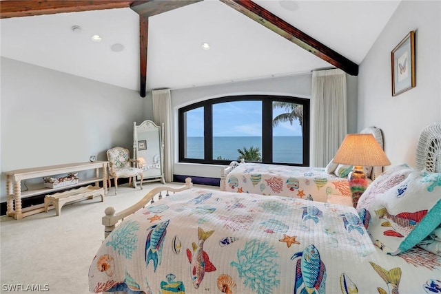 bedroom featuring vaulted ceiling with beams, carpet floors, and a water view