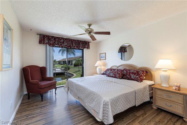 bedroom with access to exterior, ceiling fan, dark hardwood / wood-style flooring, and a textured ceiling