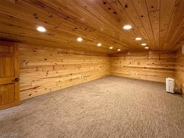 empty room featuring wood ceiling, wood walls, and carpet flooring