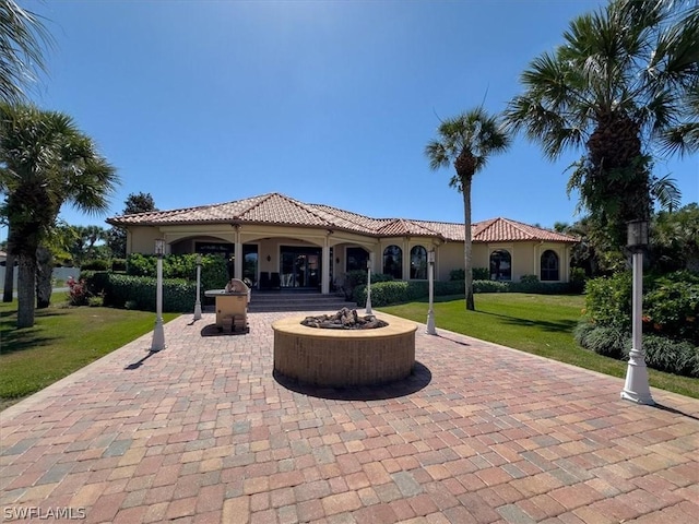 view of patio with a gazebo and a fire pit