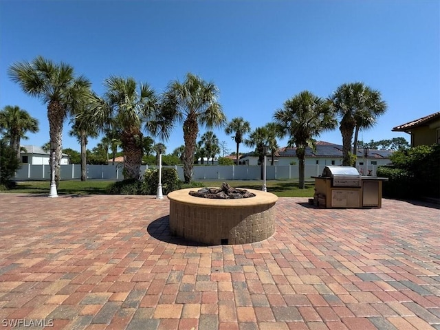 view of patio with a fire pit, area for grilling, and grilling area