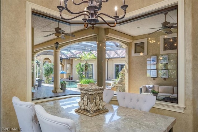 sunroom featuring decorative columns and plenty of natural light