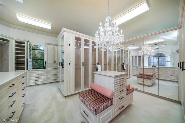 spacious closet with an inviting chandelier