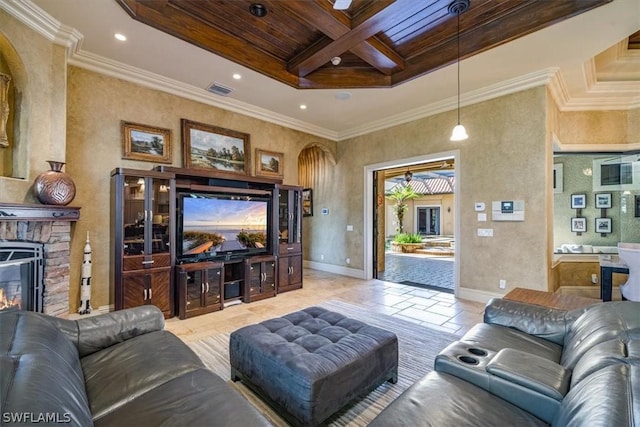 living room with ornamental molding, coffered ceiling, beam ceiling, wood ceiling, and a stone fireplace