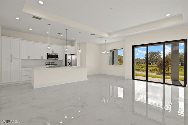 unfurnished living room featuring light marble finish floors, a raised ceiling, recessed lighting, baseboards, and a chandelier
