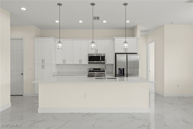 kitchen with stainless steel appliances, light marble finish flooring, baseboards, a center island with sink, and tasteful backsplash