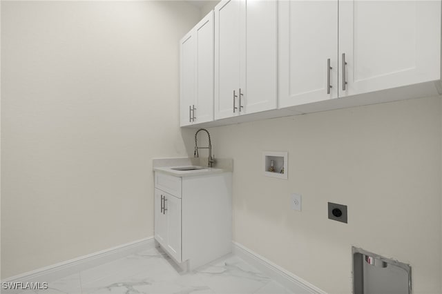 laundry room featuring hookup for an electric dryer, cabinet space, light marble finish floors, baseboards, and hookup for a washing machine