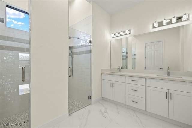 full bathroom with a shower stall, marble finish flooring, double vanity, and baseboards