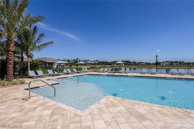 view of swimming pool featuring a patio area