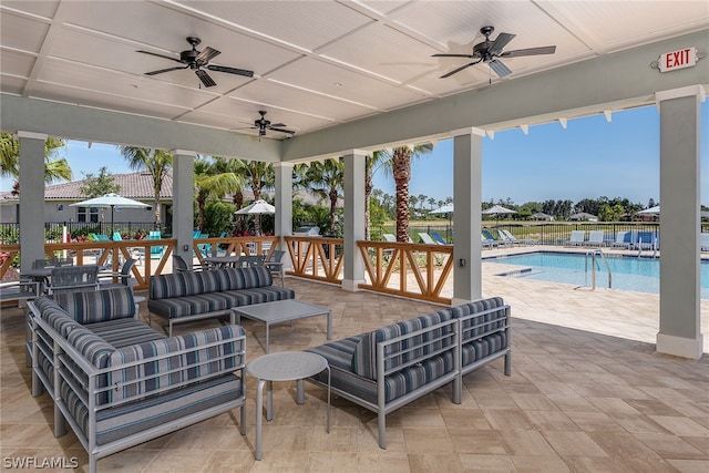 view of patio featuring an outdoor living space and a community pool