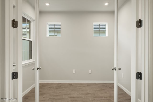 spare room with hardwood / wood-style flooring