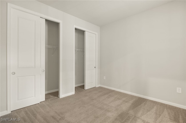 unfurnished bedroom with carpet floors