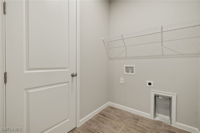 clothes washing area with hookup for an electric dryer and washer hookup