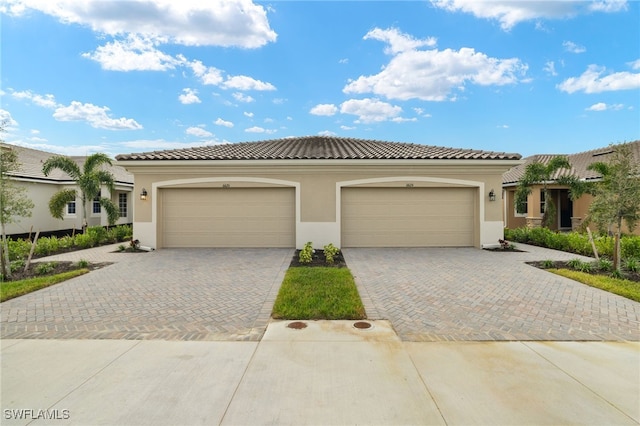 mediterranean / spanish house with a garage