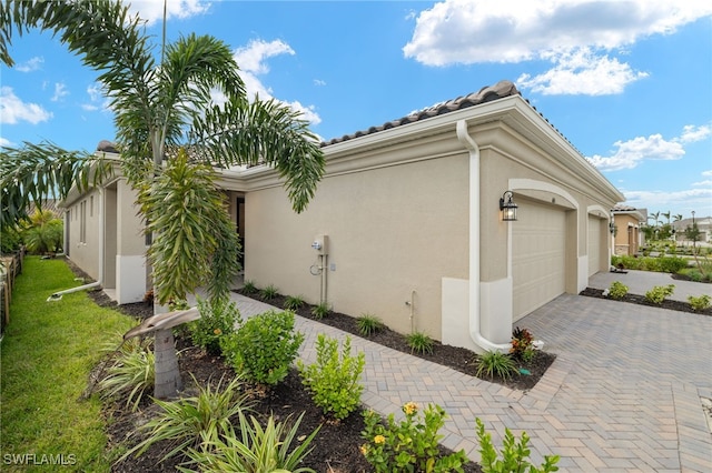 view of property exterior featuring a garage