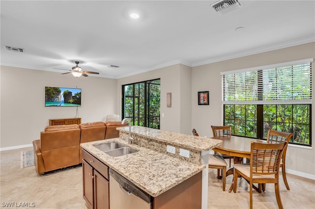 kitchen featuring dishwasher, sink, a kitchen island with sink, and crown molding