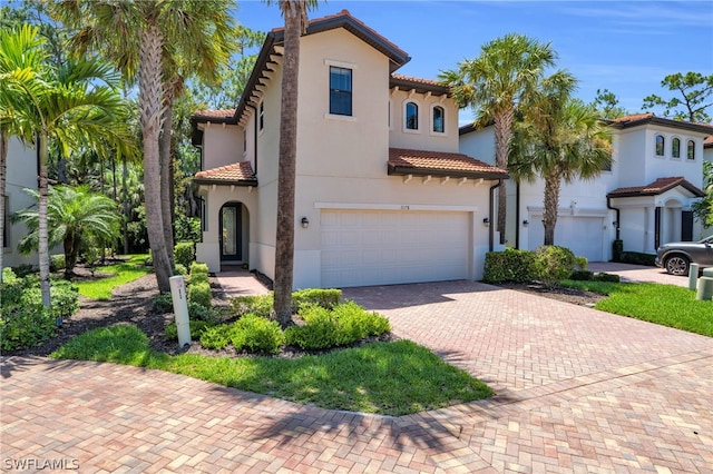 mediterranean / spanish-style home featuring a garage