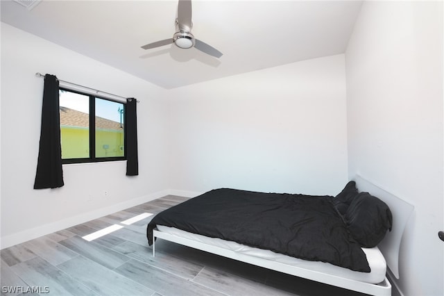 bedroom featuring ceiling fan and hardwood / wood-style floors