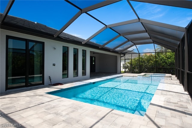 view of pool featuring a patio area and a lanai