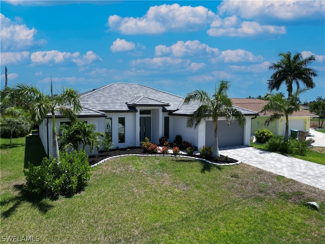 ranch-style house with a garage and a front yard