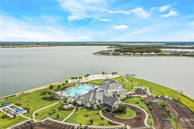 birds eye view of property with a water view